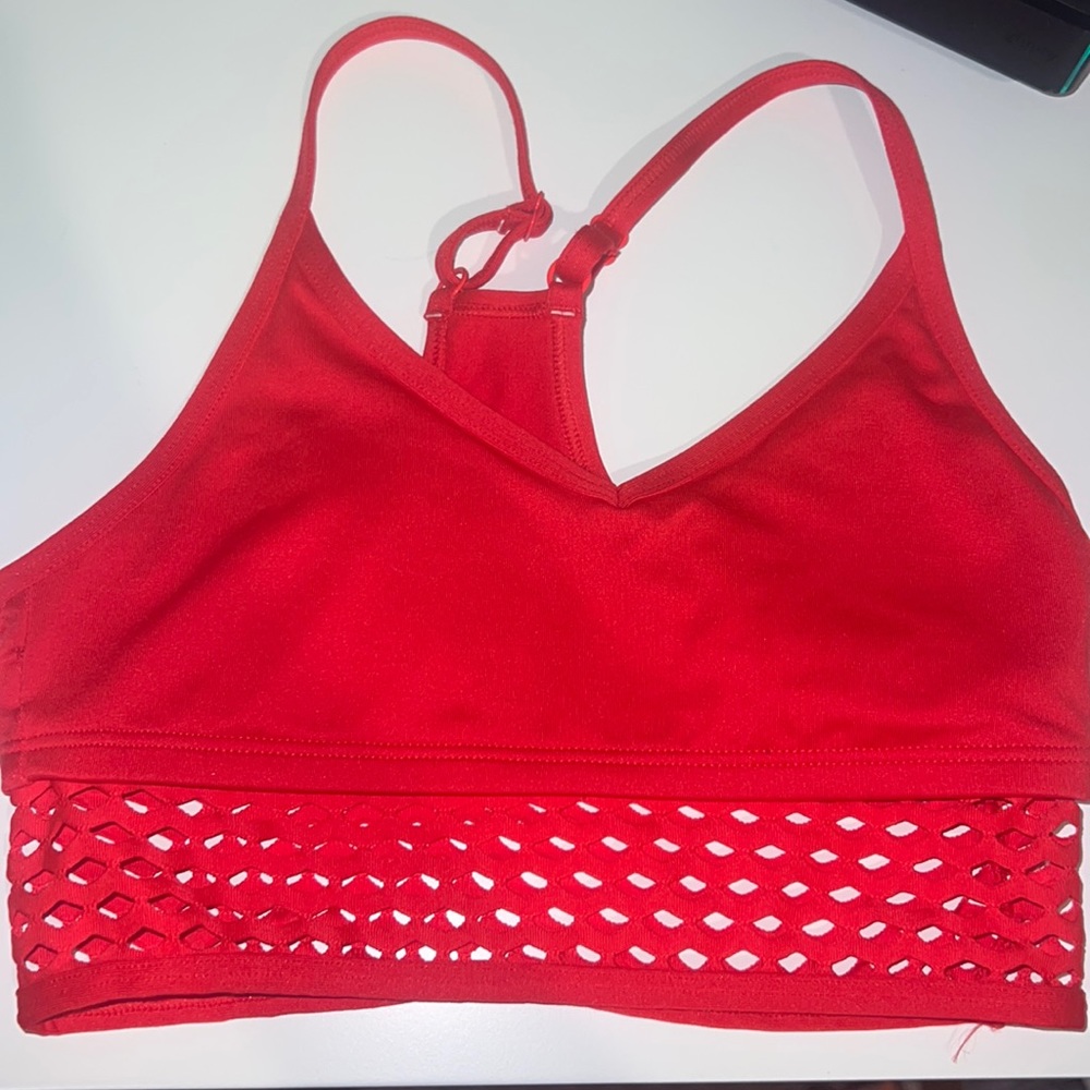 red sports bra with mesh. size x small victoria’s secret. lightly used